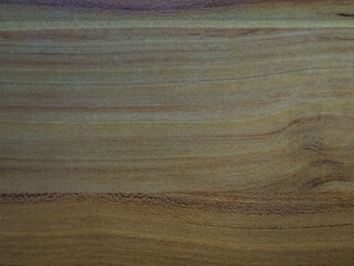 Fototapeta premium Close-up of a wooden surface with rich brown tones and natural grain variations.
