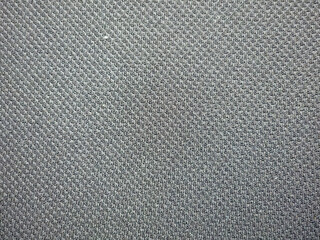 Textured fabric with a dark gray color, featuring a subtle woven pattern.