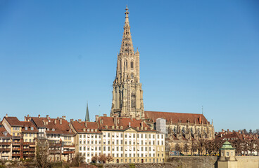 Fototapeta premium Switzerland, Bern cityscape, Traditional architecture buildings and Bern Minster, clear blue sky