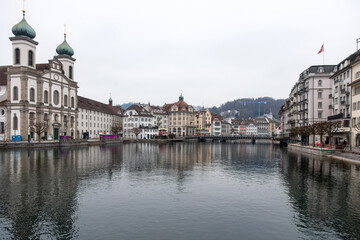 Switzerland, Lucerne. Old city, Altstadt. Jesuit Church and other historic buildings on the banks of Reuss River.