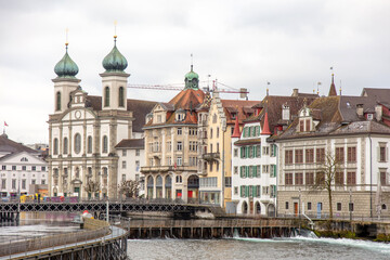 Switzerland, Lucerne. Old city, Altstadt. Jesuit Church and other historic buildings on the banks...
