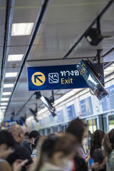 Crowd of People in a Busy Subway Station with Clear Exit Sign MRT station platform Bangkok