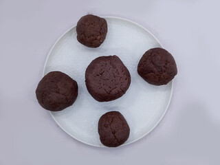 Deliciously Cooked Finger Millet Balls on a White Background. Nutritious Finger Millet Balls (Ragi Mudde) Served on a Clean White Background. Freshly Cooked Finger Millet Balls on a Minimalist White