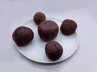 Deliciously Cooked Finger Millet Balls on a White Background. Nutritious Finger Millet Balls (Ragi Mudde) Served on a Clean White Background. Freshly Cooked Finger Millet Balls on a Minimalist White