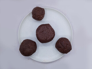 Deliciously Cooked Finger Millet Balls on a White Background. Nutritious Finger Millet Balls (Ragi Mudde) Served on a Clean White Background. Freshly Cooked Finger Millet Balls on a Minimalist White