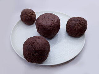 Deliciously Cooked Finger Millet Balls on a White Background. Nutritious Finger Millet Balls (Ragi Mudde) Served on a Clean White Background. Freshly Cooked Finger Millet Balls on a Minimalist White