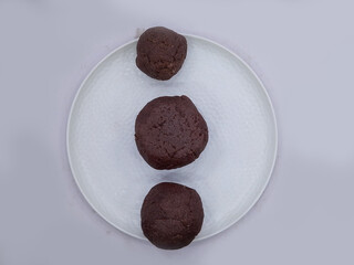 Deliciously Cooked Finger Millet Balls on a White Background. Nutritious Finger Millet Balls (Ragi Mudde) Served on a Clean White Background. Freshly Cooked Finger Millet Balls on a Minimalist White