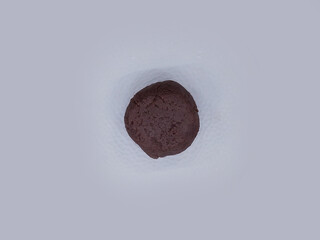 Naklejka premium Deliciously Cooked Finger Millet Balls on a White Background. Nutritious Finger Millet Balls (Ragi Mudde) Served on a Clean White Background. Freshly Cooked Finger Millet Balls on a Minimalist White