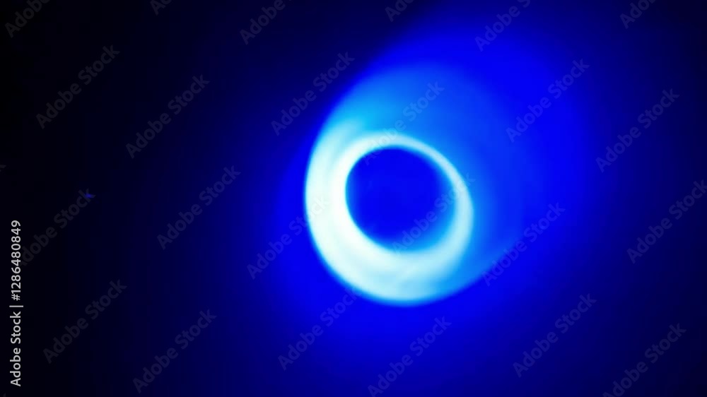 Aufkleber a vibrant blue light beam cuts through the darkness, creating captivating designs and patterns in a 