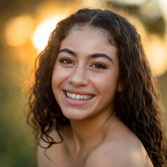 Joyful Young Woman Laughing Outdoors in Sunlight