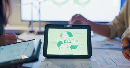 Closeup group Asia businesspeople talk ESG strategies risk management workshop night, SDGs, global warming, green finance and investment and net zero waste lifestyle in boardroom training building.