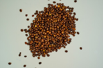 Coffee beans on a white background. Close-up. Space for text
