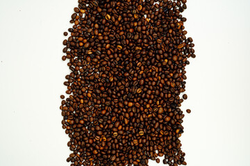 Coffee beans on a white background. Close-up. Space for text