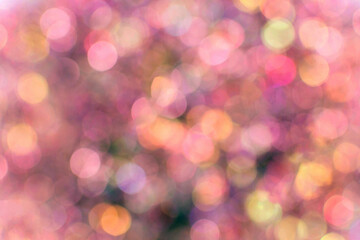 Abstract colorful bokeh background with soft pink, orange, and yellow tones
