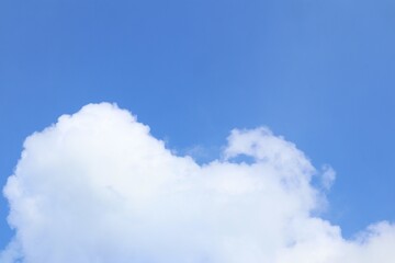 Serene Cumulus Clouds Against Azure Sky