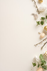 Flat lay vertical image featuring Easter decorations with golden and white eggs, willow branches,...