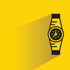 watch with shadow on yellow background
