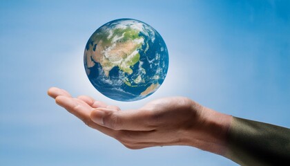 거대한 손 위에 떠 있는 작은 지구
