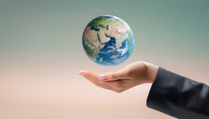 거대한 손 위에 떠 있는 작은 지구