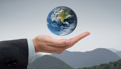 거대한 손 위에 떠 있는 작은 지구