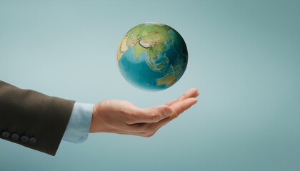 거대한 손 위에 떠 있는 작은 지구