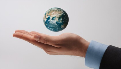 거대한 손 위에 떠 있는 작은 지구
