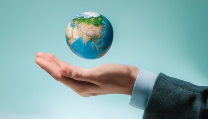 거대한 손 위에 떠 있는 작은 지구