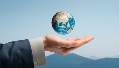 거대한 손 위에 떠 있는 작은 지구