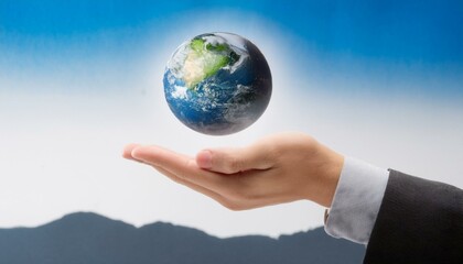 거대한 손 위에 떠 있는 작은 지구