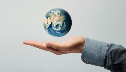 거대한 손 위에 떠 있는 작은 지구
