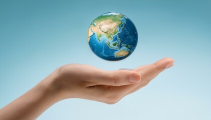 거대한 손 위에 떠 있는 작은 지구