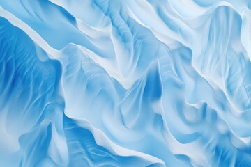 Obraz premium Abstract blue textured waves, resembling flowing fabric or sculpted snow drifts, creating a serene and calming visual.