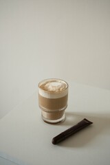 A Delicious Coffee with a Creamy Topping, Beautifully Presented on the Dining Table