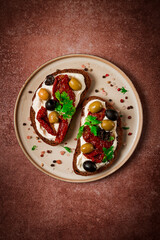 Breakfast, sandwiches, with cream cheese, olives, top view,