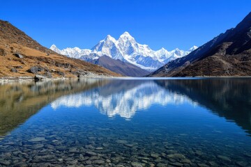 Obraz premium A lake with a reflection of snow-capped peaks, silence, crystal clear water. 