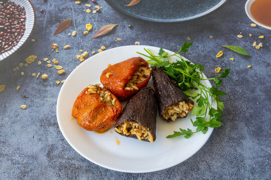 Dried eggplant stuffed and dried pepper stuffed with rice, tomato and olive oil known as dolma. (Turkish name; kuru biber dolmasi, kuru patlican dolmasi)
