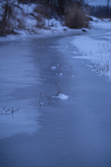 Frozen river in winter. Beautiful winter landscape. 
