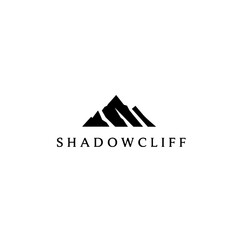 Minimalist Logo Featuring Mountain Silhouette and Shadow Cliff Text