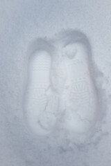 Two Foot prints in fresh snow