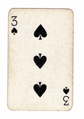 A well used and grubby spades playing card on a white background.