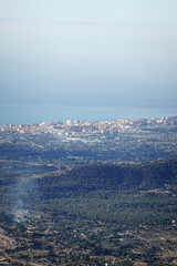 Obraz premium The panorama opening from the pick Puig Camapan in the direction of Benidorm and sea, Spain 