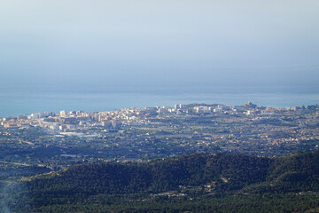 The panorama opening from the pick Puig Camapan in the direction of Benidorm and sea, Spain 