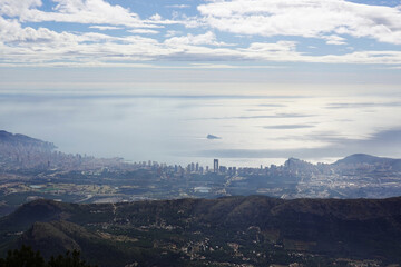 The panorama opening from the pick Puig Camapan in the direction of Benidorm and sea, Spain 