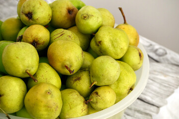 natural winter pears, natural ripe pears without hormones, in a large bowl on the balcony,