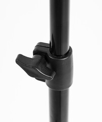 Black Chinese tripod, close-up details. White background.
