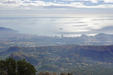 The panorama opening from the pick Puig Camapan in the direction of Benidorm and sea, Spain 
