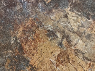 Close up of rusty and weathered granite stone texture, suitable for outdoor and exterior flooring. Oxidized, copper and grey color. Seamless stone background texture.