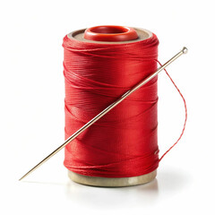 A spool of vibrant red thread with a sewing needle resting