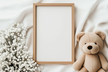 Teddy bear and blank frame mockup on white fabric. Teddy bear and frame with flowers mockup. Teddy bear and frame on white background