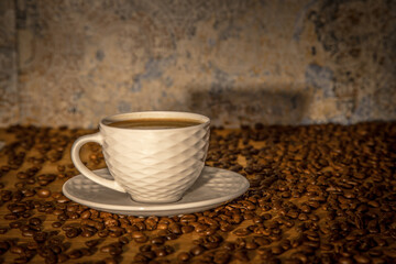 cup of coffee, scattered grain, soft light, roasted coffee, background, pattern, texture, shadow,...